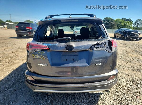 JTMWFREV5JD109811 2018 TOYOTA RAV4 Gray Vista trasera
