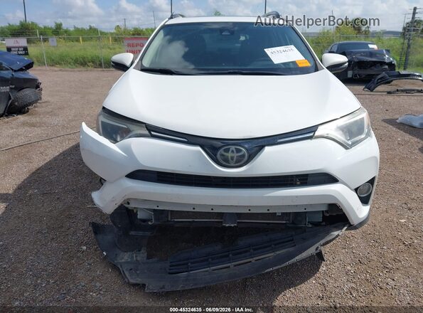 JTMWFREV5JJ193341 2018 TOYOTA RAV4 White Vista interior trasera