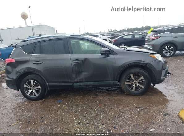 JTMWFREV6HJ149102 2017 TOYOTA RAV4 Gray Rear interior view