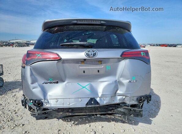JTMWFREV7JD126299 2018 TOYOTA RAV4 Silver Հետևի տեսք