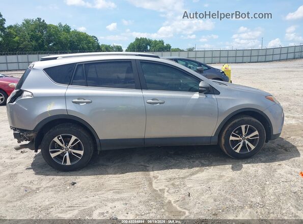 JTMWFREV8JJ177375 2018 TOYOTA RAV4 Gray Rear interior view