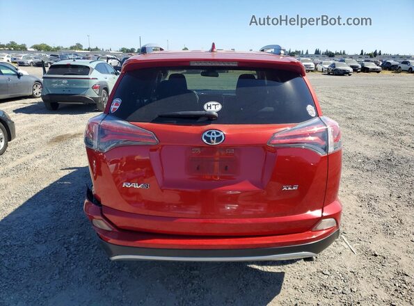 JTMWFREV9HJ131404 2017 TOYOTA RAV4 Red Rear view