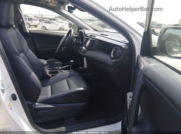 JTMYFREV0JD114083 2018 TOYOTA RAV4 White Front interior view