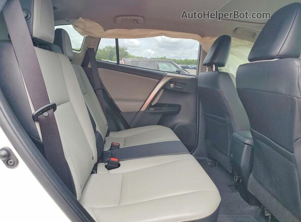 JTMYFREV2JJ205955 2018 TOYOTA RAV4 White Vista interior trasera