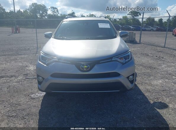JTMYFREV8JJ211727 2018 TOYOTA RAV4 Silver Սարքավորումների վահանակի տեսք