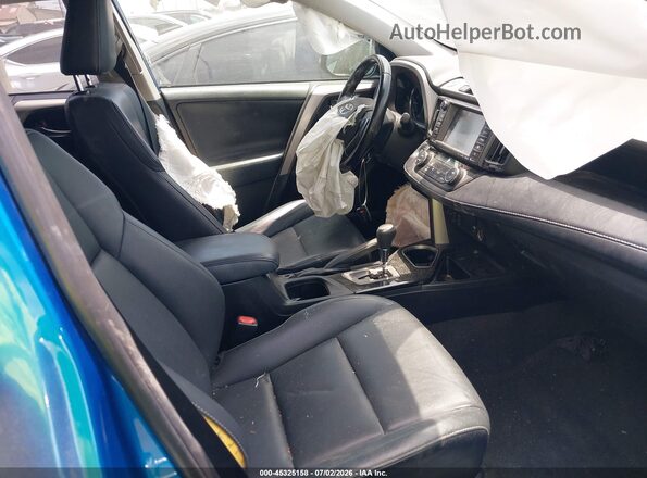 JTMYFREV9JJ725957 2018 TOYOTA RAV4 Blue Front interior view