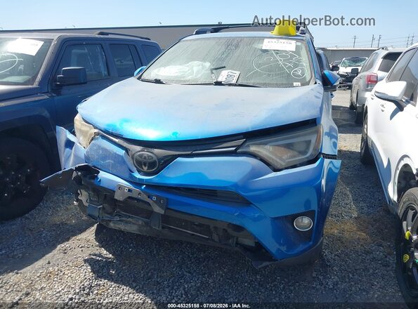 JTMYFREV9JJ725957 2018 TOYOTA RAV4 Blue Rear interior view