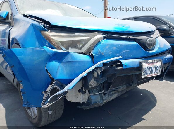 JTMYFREV9JJ725957 2018 TOYOTA RAV4 Blue Front view