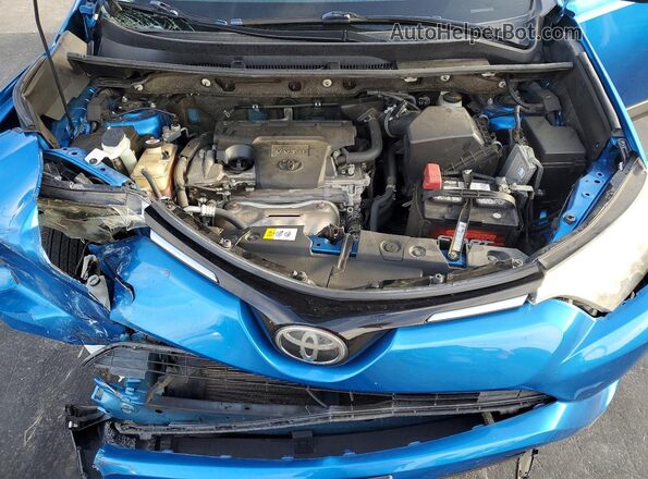 JTMZFREV0HJ132096 2017 TOYOTA RAV4 Blue Rear interior view