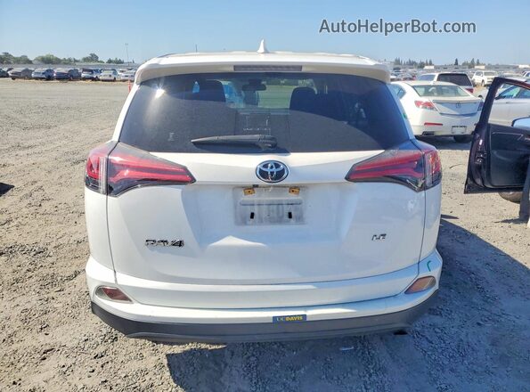 JTMZFREV3HJ147918 2017 TOYOTA RAV4 White Rear view
