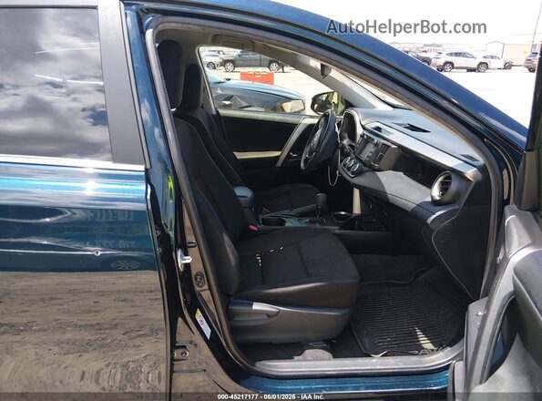 JTMZFREV3JJ731502 2018 TOYOTA RAV4 Dark Blue Front interior view