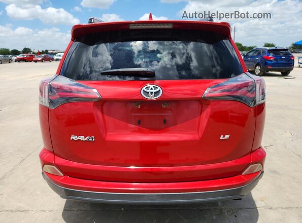 JTMZFREV8GJ077234 2016 TOYOTA RAV4 Red Rear view