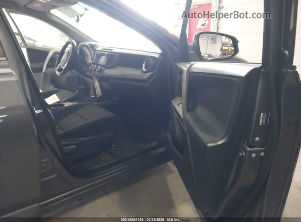 JTMZFREVXGJ078756 2016 TOYOTA RAV4 Gray Front interior view