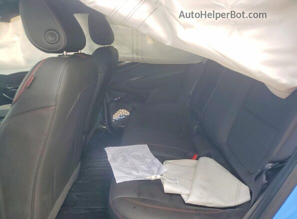 KL77LJE23RC215712 2024 CHEVROLET TRAX Синий Вид задней части салона