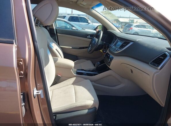KM8J23A49GU098901 2016 HYUNDAI TUCSON Brown Սալոնի դիմացի տեսք