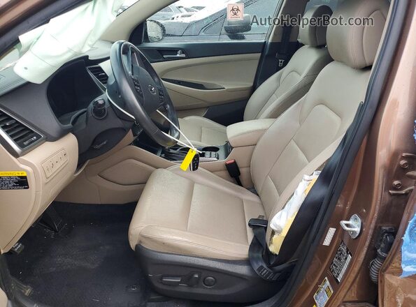 KM8J33A25GU036357 2016 HYUNDAI TUCSON Tan წინა სალონის ხედი