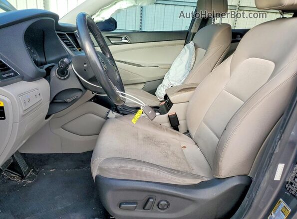 KM8J33A27GU140574 2016 HYUNDAI TUCSON Gray Front interior view