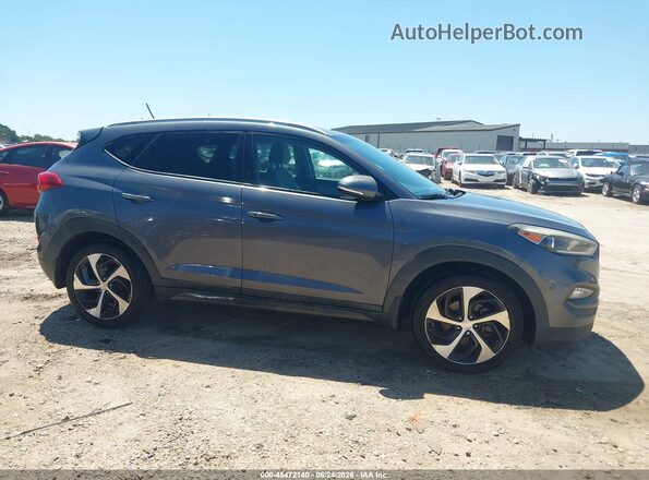 KM8J33A27GU179164 2016 HYUNDAI TUCSON Gray Սալոնի հետևի տեսք