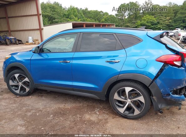 KM8J33A29GU185547 2016 HYUNDAI TUCSON Blue Widok wnętrza z tyłu