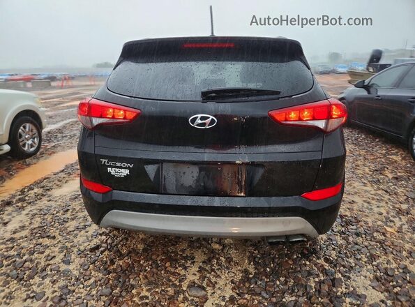 KM8J33A2XHU579964 2017 HYUNDAI TUCSON Black Rear view