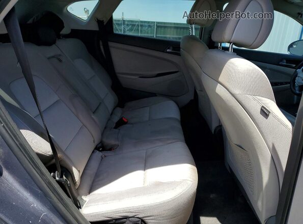 KM8J33A41GU105174 2016 HYUNDAI TUCSON Gray Vista interior trasera