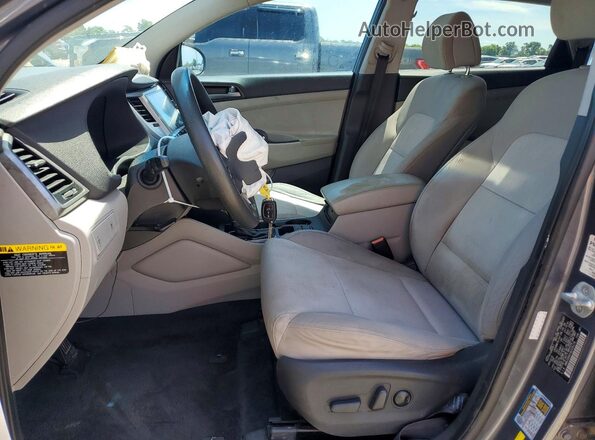 KM8J33A41GU105174 2016 HYUNDAI TUCSON Gray Vista interior delantera