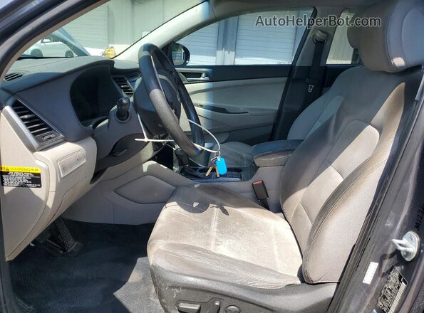 KM8J33A42GU076252 2016 HYUNDAI TUCSON Charcoal წინა სალონის ხედი