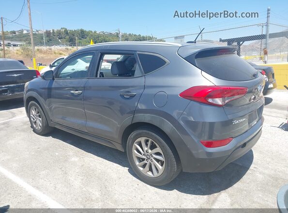 KM8J33A46GU090266 2016 HYUNDAI TUCSON Gray Trasero izquierdo