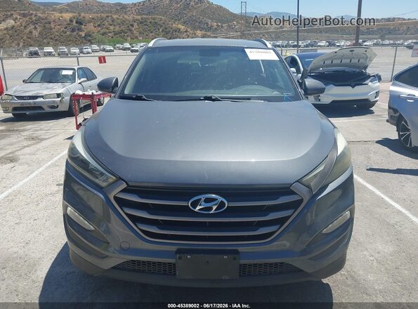 KM8J33A46GU090266 2016 HYUNDAI TUCSON Gray Vista interior trasera