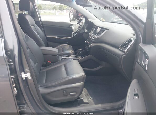 KM8J33A4XHU548005 2017 HYUNDAI TUCSON Gray წინა სალონის ხედი