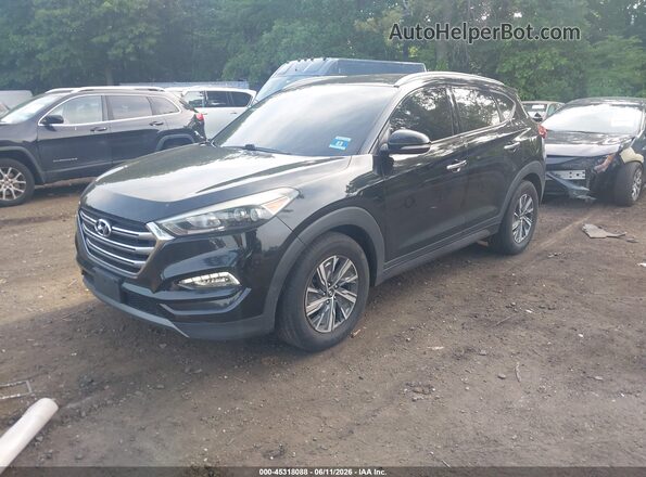 KM8J3CA21GU119963 2016 HYUNDAI TUCSON Black 