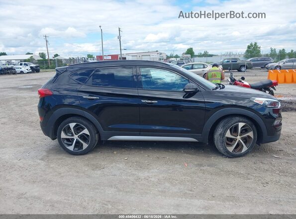 KM8J3CA2XGU257467 2016 HYUNDAI TUCSON Black Սալոնի հետևի տեսք