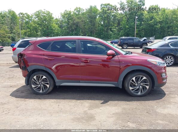 KM8J3CAL7KU847787 2019 HYUNDAI TUCSON Red Rear interior view