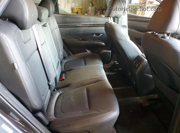 KM8JF3DEXRU280490 2024 HYUNDAI TUCSON Gray უკანა სალონის ხედი