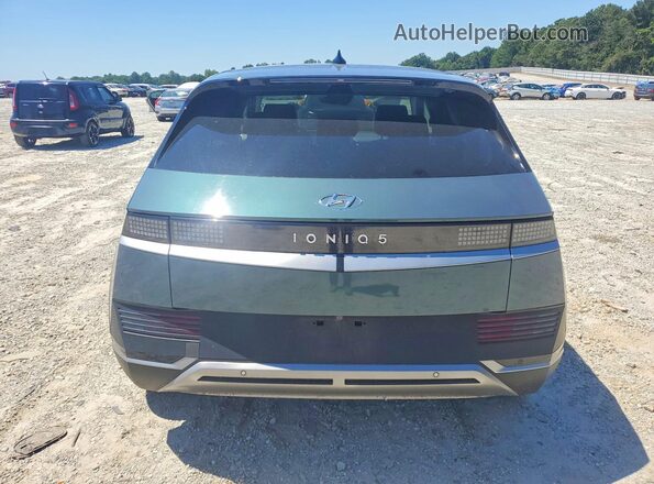 KM8KM4AE1NU080239 2022 HYUNDAI IONIQ Turquoise Vista trasera