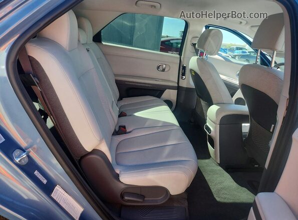 KM8KNDAF1PU229063 2023 HYUNDAI IONIQ Blue Vista interior trasera