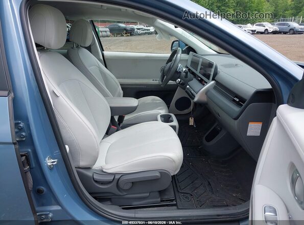 KM8KNDAF7NU103805 2022 HYUNDAI IONIQ 5 Blue Vista interior delantera