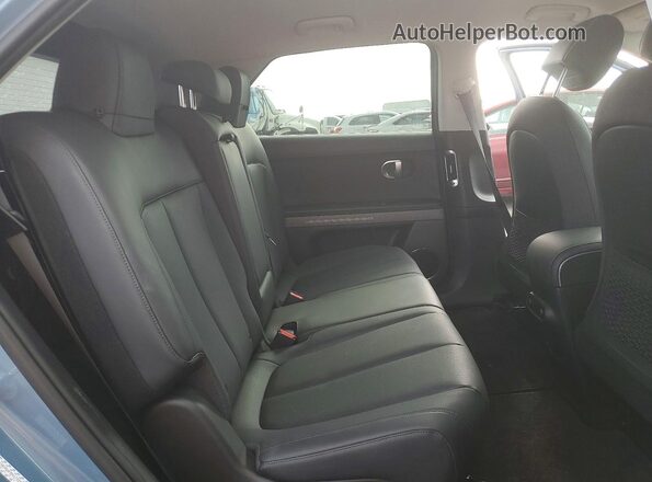 KM8KNDAF8PU173252 2023 HYUNDAI IONIQ Blue Rear interior view