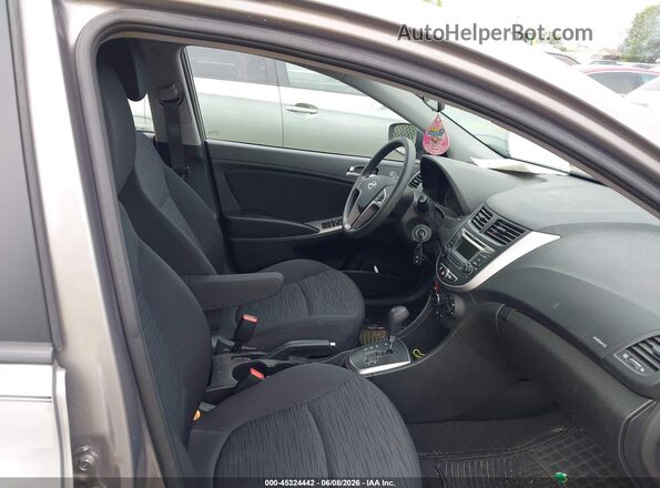 KMHCT5AE2HU357661 2017 HYUNDAI ACCENT Brown Вид салону спереду
