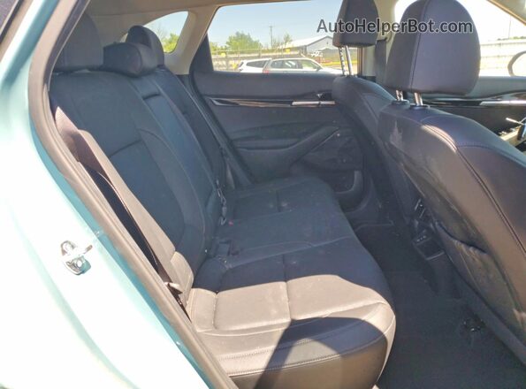 KNDERCAAXS7690662 2025 KIA SELTOS Turquoise Rear interior view