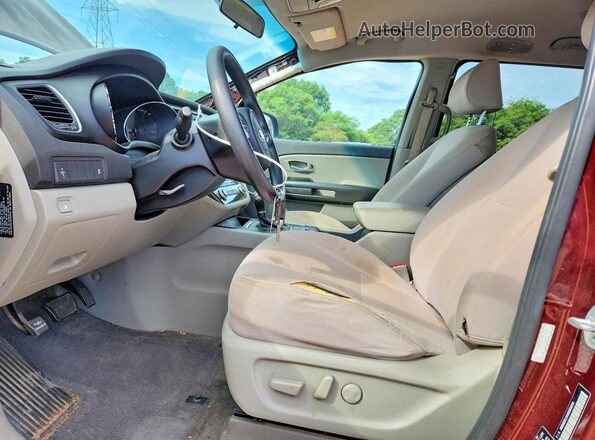 KNDMB5C14G6083260 2016 KIA SEDONA Burgundy Front interior view