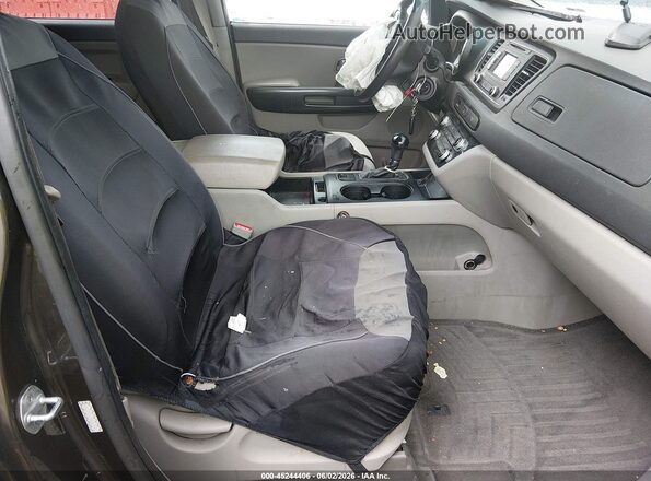 KNDMB5C15G6105024 2016 KIA SEDONA Brown Вид салону спереду