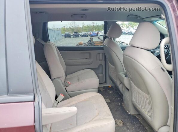 KNDMB5C17G6235287 2016 KIA SEDONA Maroon Սալոնի հետևի տեսք