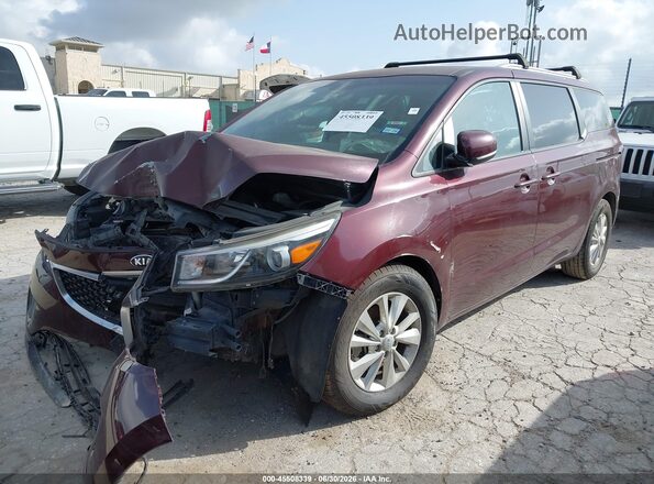 KNDMB5C17H6339523 2017 KIA SEDONA Maroon Vista tres cuartos delantera izquierda
