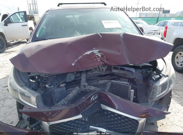 KNDMB5C17H6339523 2017 KIA SEDONA Maroon Vista interior trasera