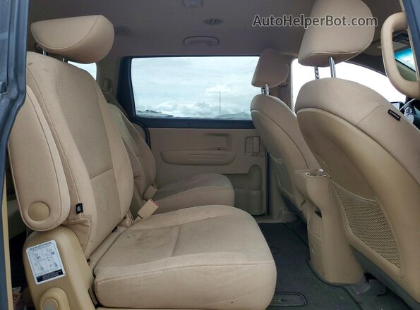 KNDMB5C19H6219304 2017 KIA SEDONA Beige Սալոնի հետևի տեսք
