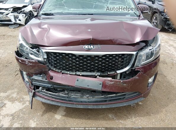KNDMC5C12H6255641 2017 KIA SEDONA Burgundy Front view