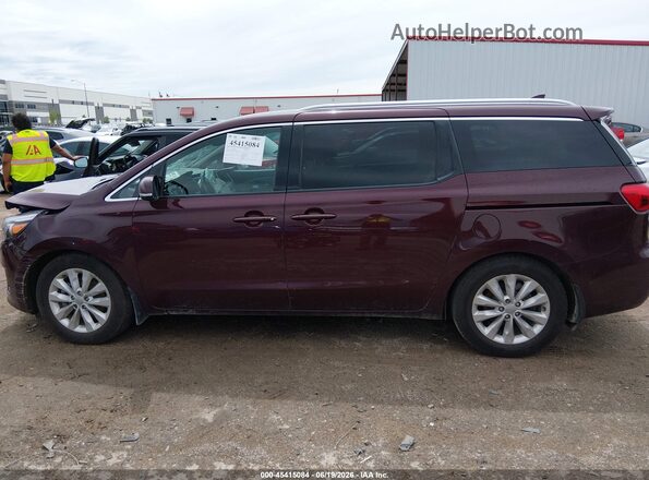 KNDMC5C12H6255641 2017 KIA SEDONA Burgundy Rear interior view