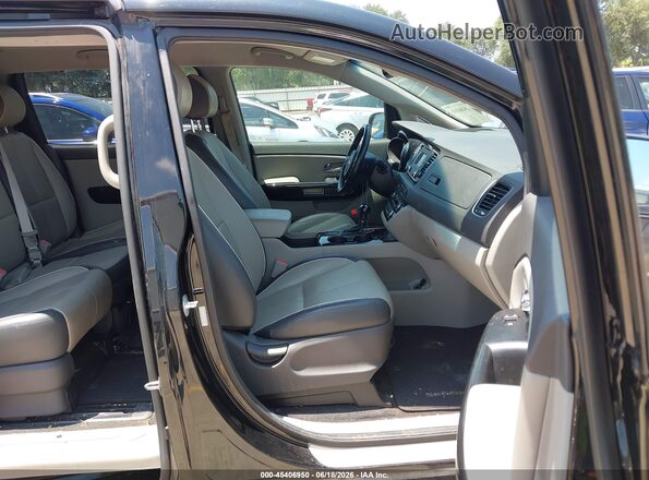 KNDMC5C18G6146972 2016 KIA SEDONA Черный Вид салона спереди