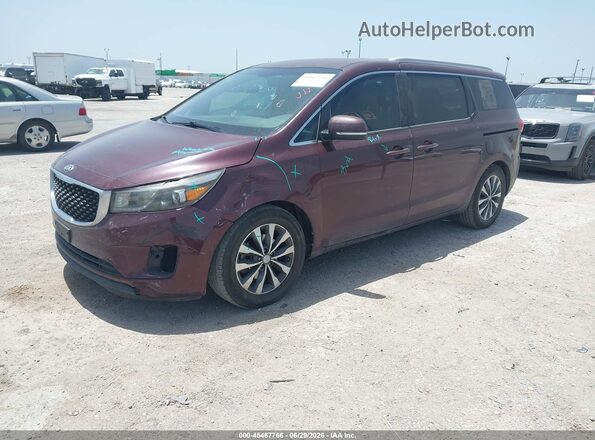 KNDMC5C1XG6147086 2016 KIA SEDONA Burgundy Przód lewy
